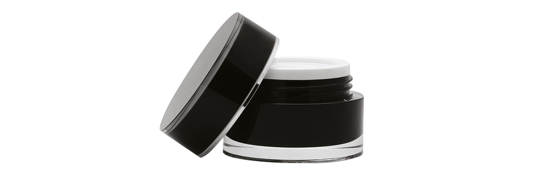 an open, matte black jar of moisturizer