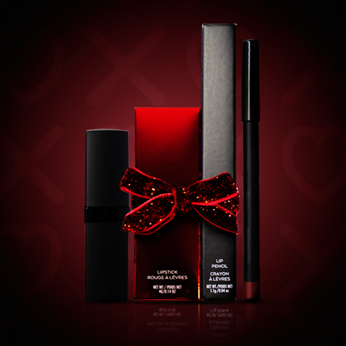 Gift-ready lipstick and lip pencil duo with black lipstick tube, metallic red lipstick box, and pencil box tied together with a red glitter bow on a dark background. Ready to Brand with your logo.